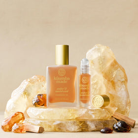 Kuumba Made open bottle applied to wrist showing quick touch-up convenience