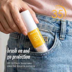KYDA powder tucked in a beach bag illustrating sun-safe travel routine