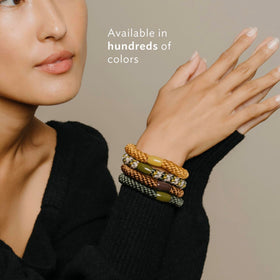 L. Erickson hair tie used in a relaxed bun highlighting damage-free styling