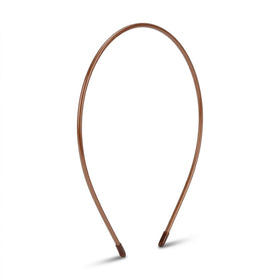 L. Erickson front view showing slim tortoise headband, neat polished look