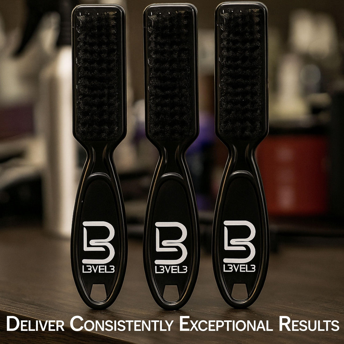 L3 brush in a barber hand in use delivering precise fades and clean lines