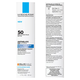 La Roche-Posay travel-size tube next to passport showing portability