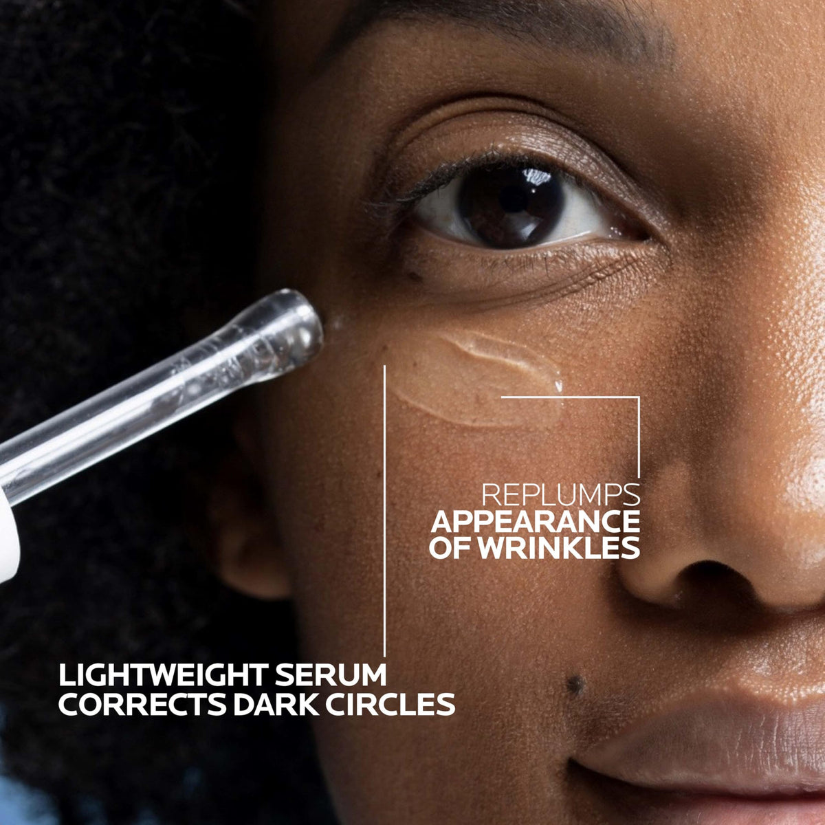 Applying La Roche-Posay Hyalu B5 Eye Serum onto hand before under-eye use for smooth glide