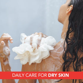 Lactovit in use under shower illustrating gentle cleansing and hydration