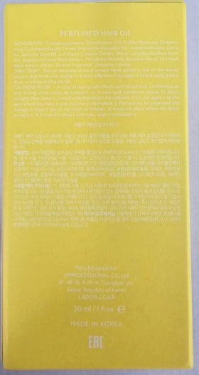 LA'DOR bottle beside hand showing compact 1 fl oz travel-friendly size