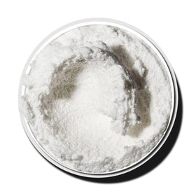 LALICIOUS scoop of scrub on hand demonstrating application and easy, non-greasy glide