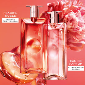 Lancôme bottles layered on vanity illustrating mixing fragrances for a personalized scent