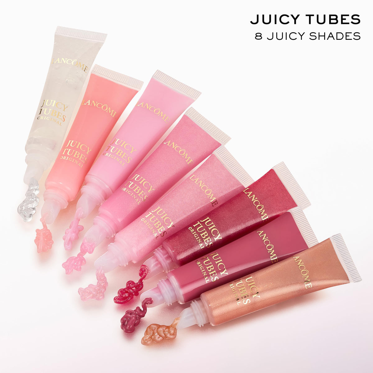 Lancôme Juicy Tubes in a handbag lifestyle shot for on‑the‑go glossy touchups