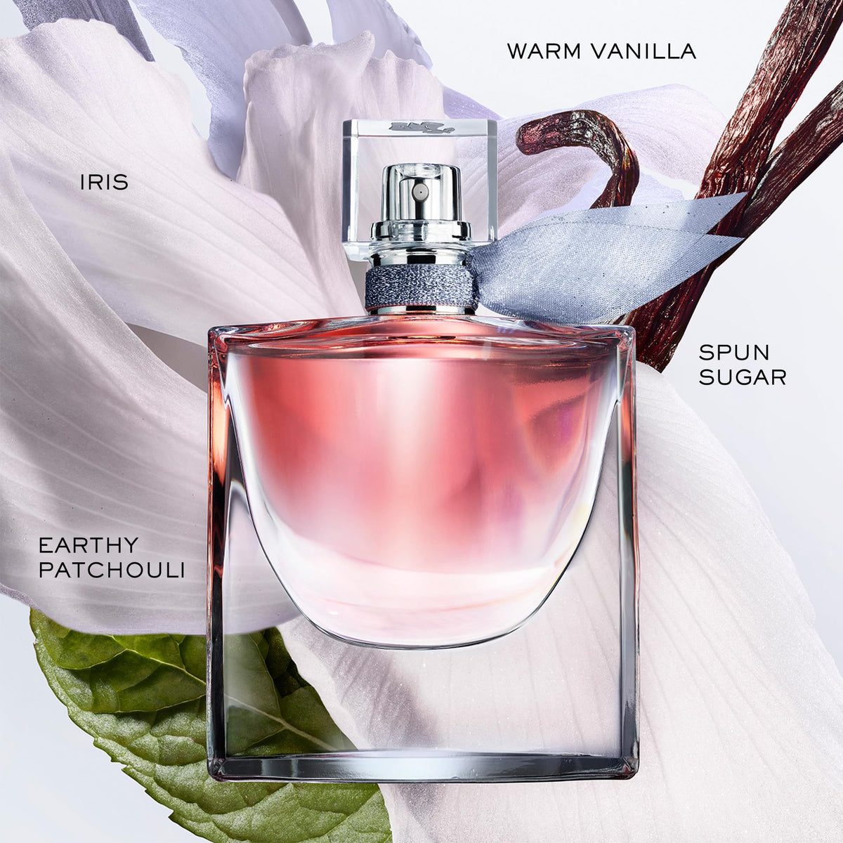 Lancôme atomizer spraying fine mist illustrating easy application and lasting scent