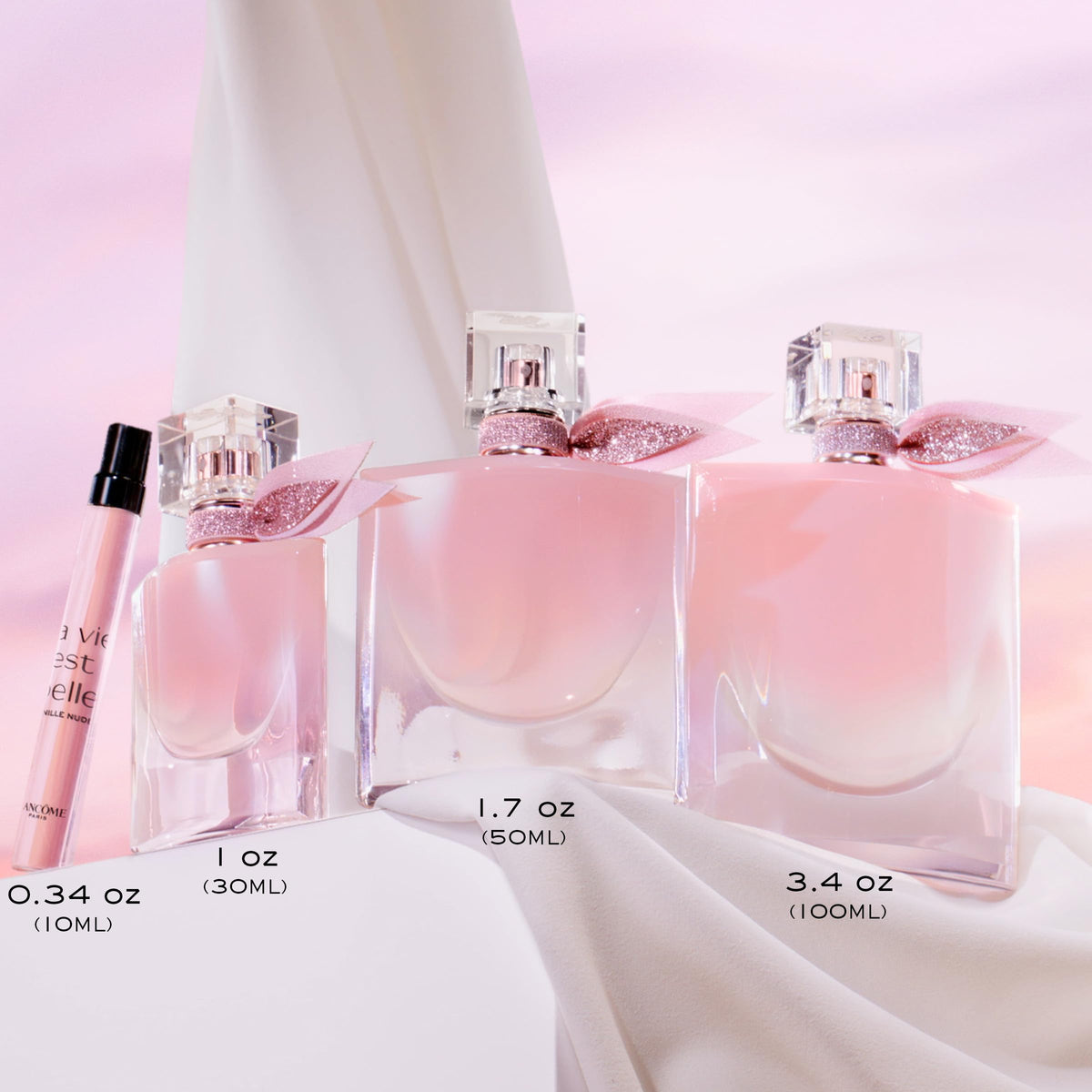 Lancôme bottle in hand illustrating compact 0.34 fl oz travel convenience