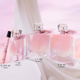 Lancôme bottle in hand illustrating compact 0.34 fl oz travel convenience