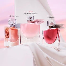 Lancôme bottle on dressing table lifestyle scene suggesting everyday elegance benefit