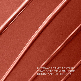 Lancôme lipstick beside ruler for size comparison and portable convenience