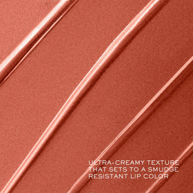 Lancôme lipstick next to hand for scale showing true product size benefit
