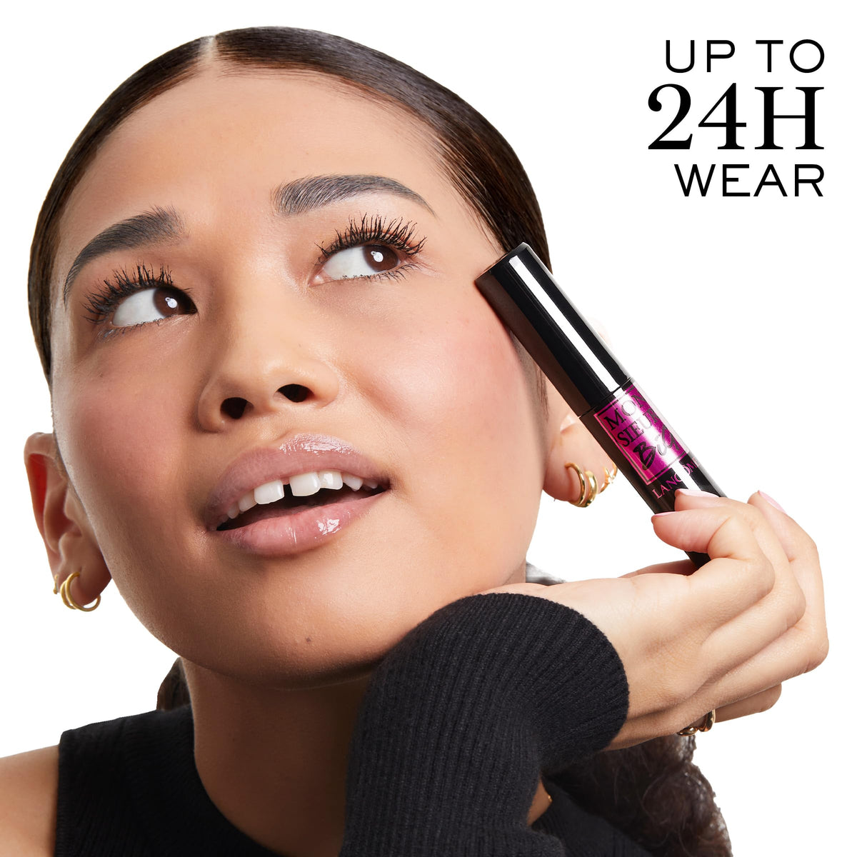 Lancôme Monsieur Big held in hand for scale showing easy application benefit