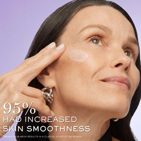Lancôme bottle in hand scale demonstrating 1.7 fl oz size and travel practicality