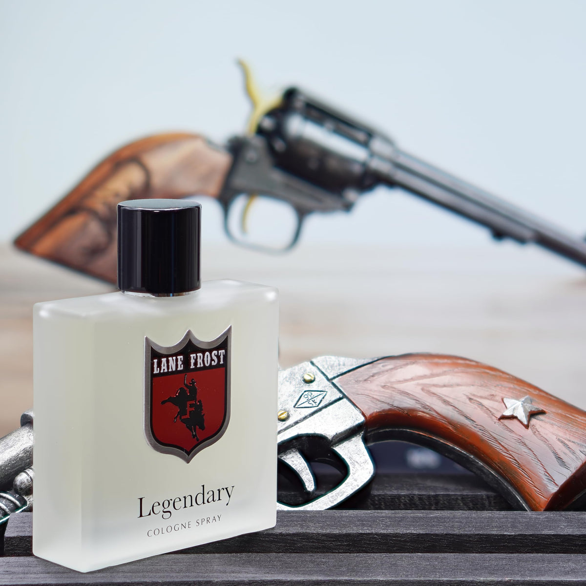 Lane Frost Legendary Frosted textured leather and cedarwood prop highlighting scent character benefit