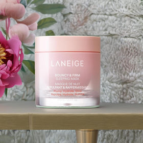 LANEIGE jar beside bedside lamp showing overnight use for plumper morning skin