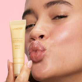 LANEIGE Lip Glowy Balm stick close-up showing smooth balm for instant shine