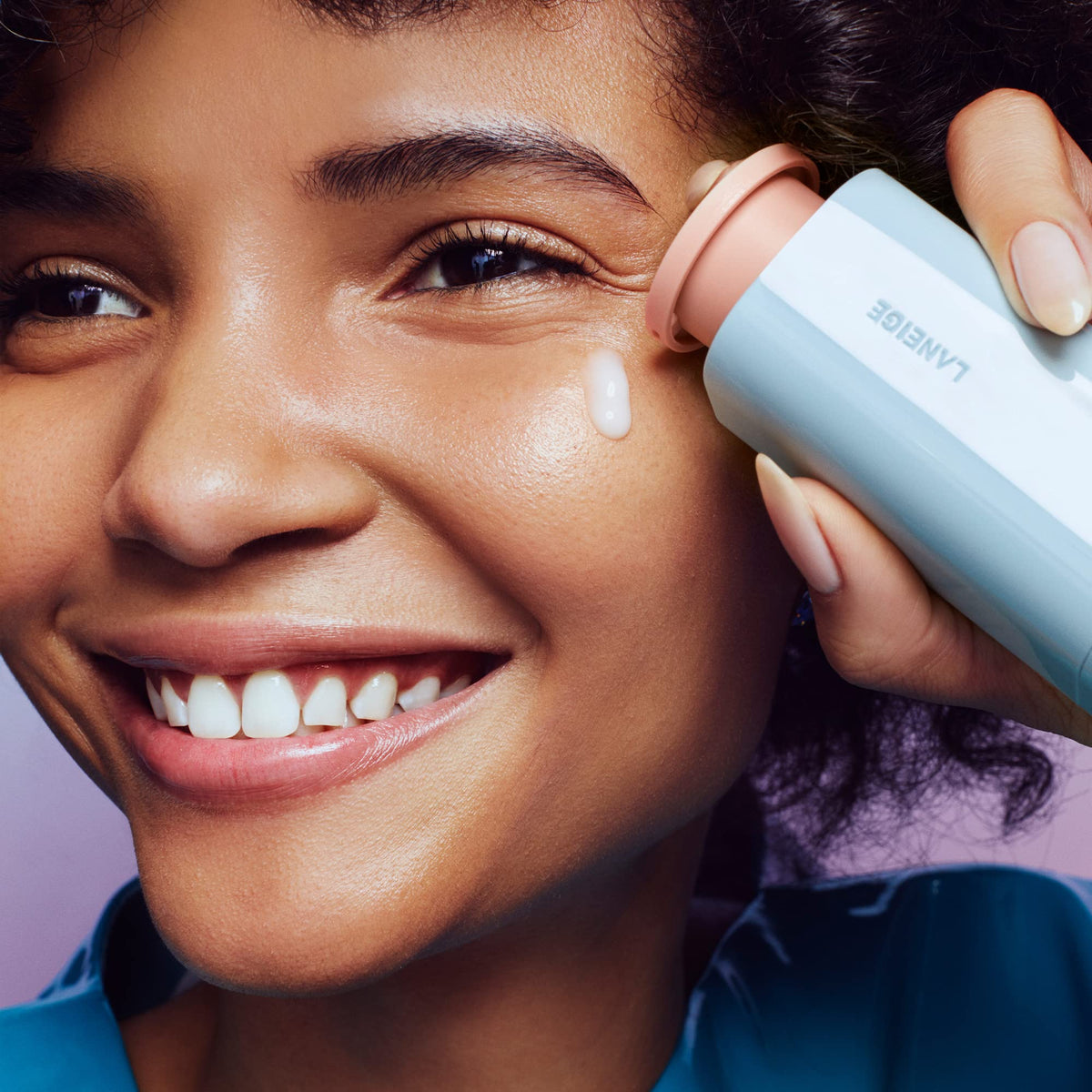 LANEIGE serum staged on bathroom vanity conveying radiant routine benefit
