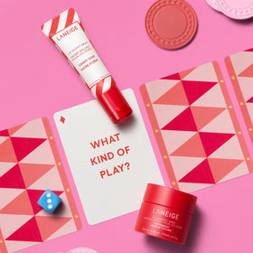 LANEIGE Lip Glowy Balm texture on fingers demonstrating glossy finish and instant hydration benefit