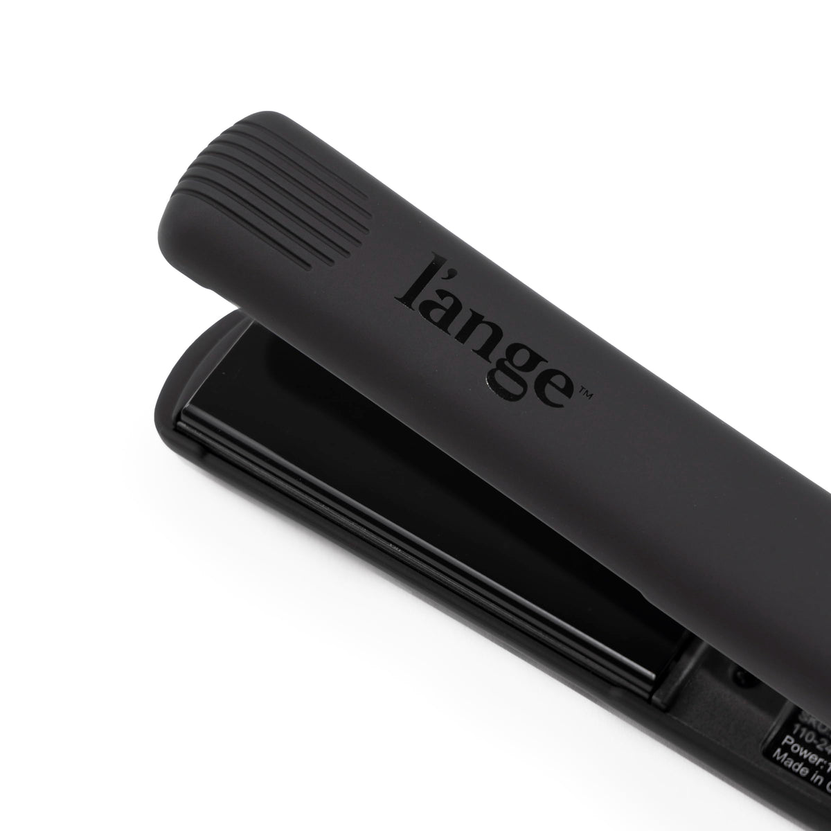 L'ANGE HAIR size comparison beside a ruler to show the compact 1-inch plate width for control