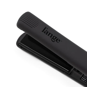 L'ANGE HAIR size comparison beside a ruler to show the compact 1-inch plate width for control