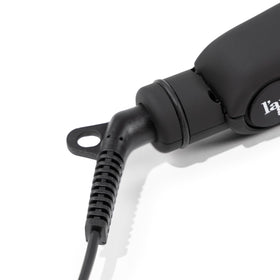 L'ANGE HAIR flat iron styling a model's hair, demonstrating frizz reduction and glossy results