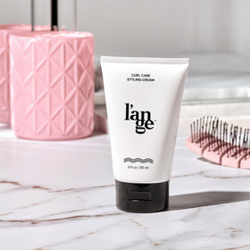 L'ANGE HAIR model with defined curls demonstrating hydrated results