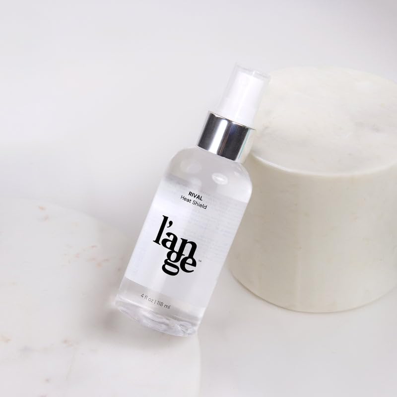 L'ANGE HAIR Rival Heat Shield 4 oz bottle in hand showing compact travel-friendly size