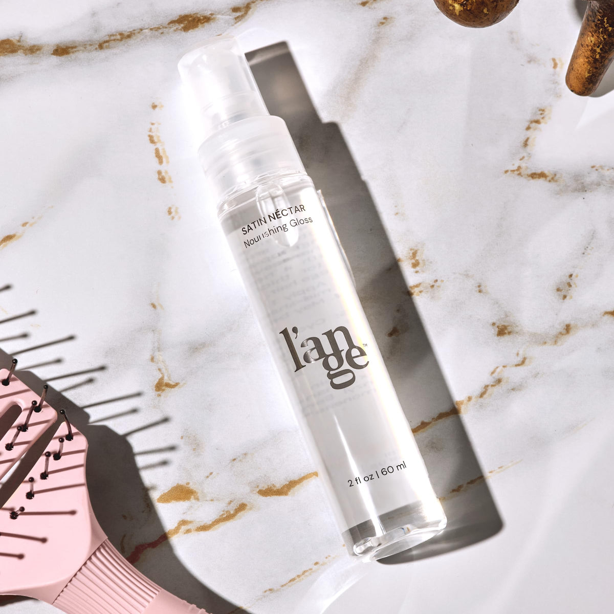 L'ANGE HAIR applied to styled hair showing frizz control and polished finish