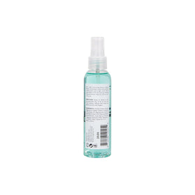 L'ANGE HAIR bottle in beach setting conveying effortless, natural style