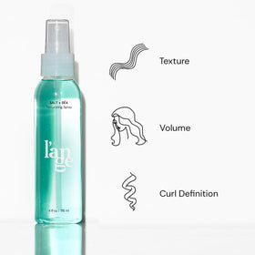 L'ANGE HAIR fine mist spray in air illustrating even product distribution