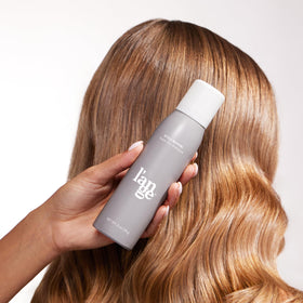 L'ANGE HAIR spray being used in morning routine for instant volume