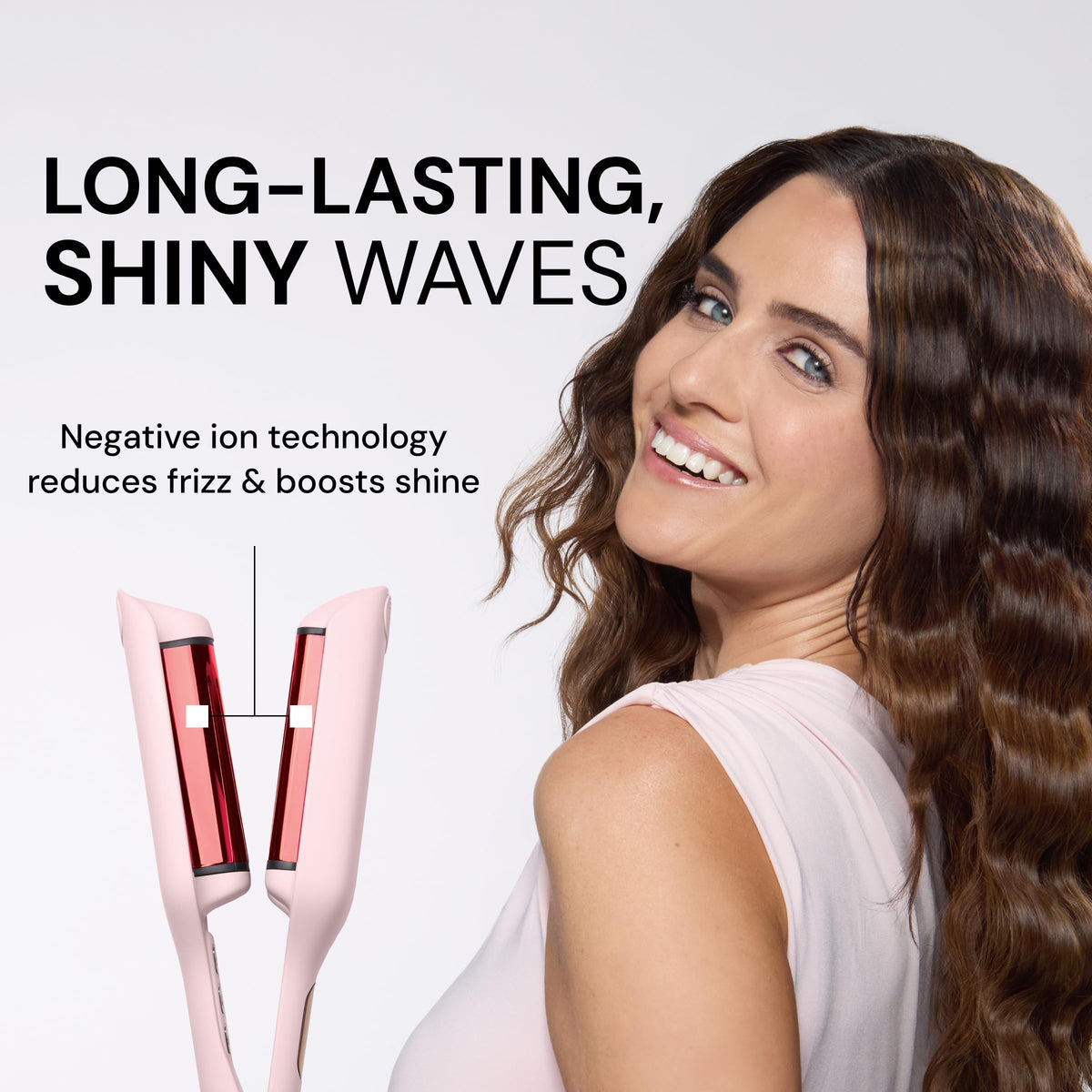 L'ANGE HAIR tool held in hand showing size and lightweight travel benefit