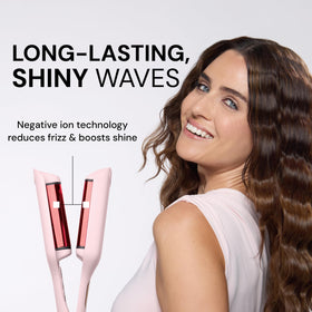 L'ANGE HAIR tool held in hand showing size and lightweight travel benefit