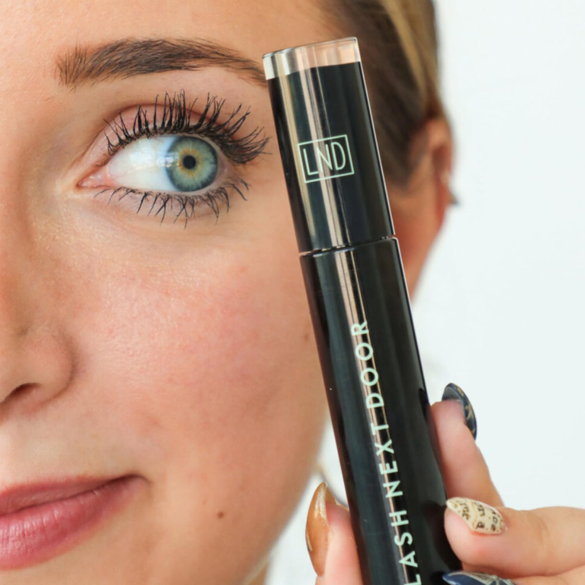 LASH NEXT DOOR open tube showing rich black pigment ready to apply