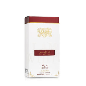 Lattafa Ana Abiyedh Rouge bottle on dresser with ambient light, lifestyle mood and daily-wear benefit