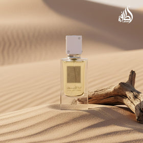 Lattafa Ana Abiyedh held in hand to show 2.0 ounce size and scale