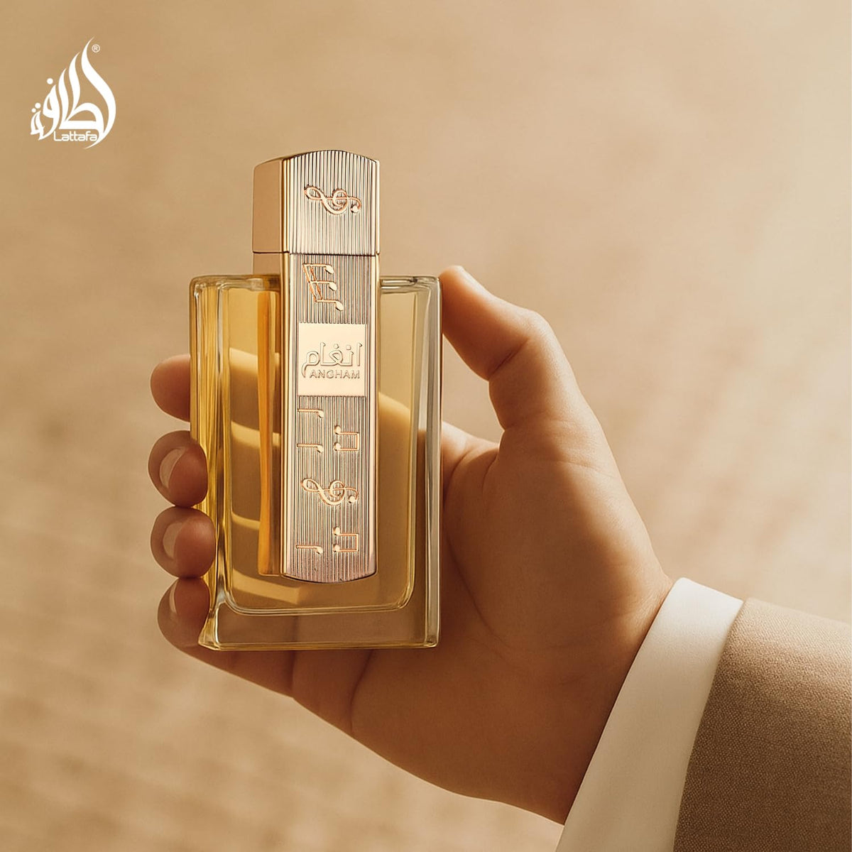 Lattafa Angham held in hand to show 100 ml size and real-world scale for purchase clarity