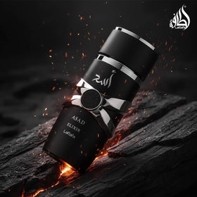 Lattafa Asad Elixir tobacco and cedar display emphasizing smoky woody heart