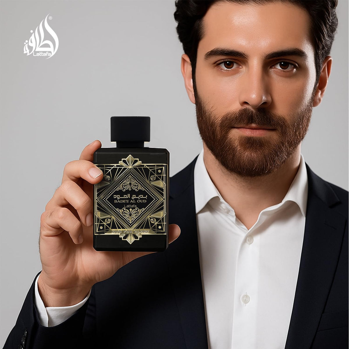 Lattafa Bade'e Al Oud bottle beside common items for size comparison clarity