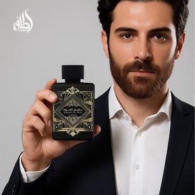 Lattafa Bade'e Al Oud bottle beside common items for size comparison clarity