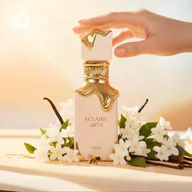 Lattafa Eclaire amber liquid texture with warm vanilla tones for cozy scent