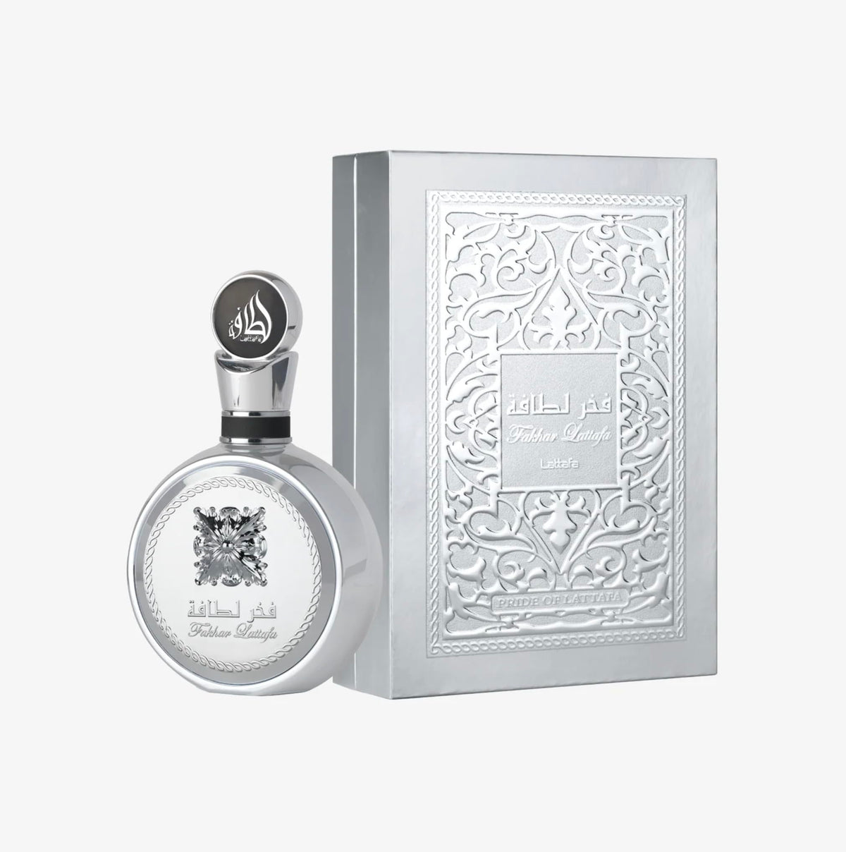 Lattafa Fakhar Platin bottle on a nightstand illustrating evening wear mood