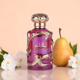 Lattafa bottle beside measuring scale showing 100 ml size clarity