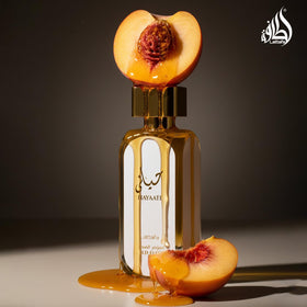 Lattafa Hayaati Gold Elixir ingredient-themed layout illustrating citrus and warm base harmony