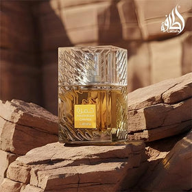 Lattafa bottle on wood surface suggesting warm, cozy scent mood