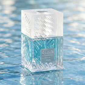 Lattafa Khamrah Waha bottle staged in desert-coast scene conveying warm-fresh contrast