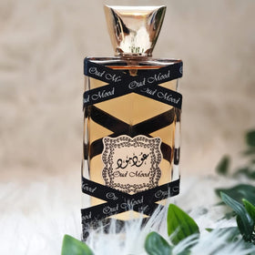 Lattafa Oud Mood next to a 3.4 oz scale object showing true size